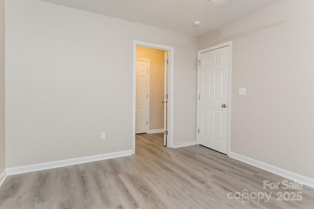 empty room with light wood-type flooring