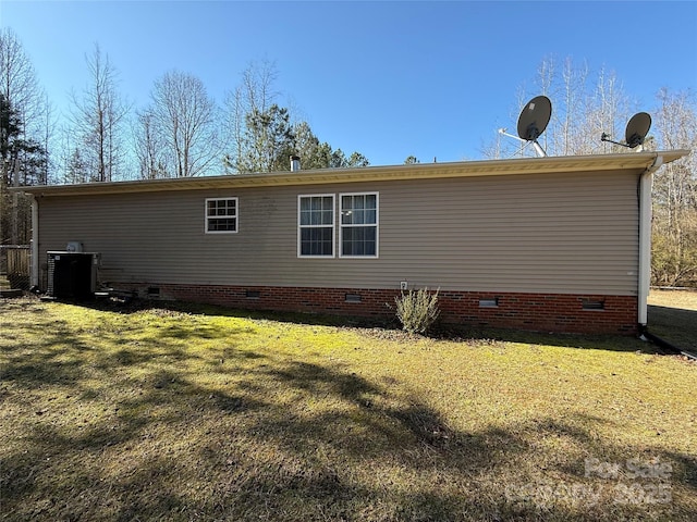 view of side of home featuring a yard