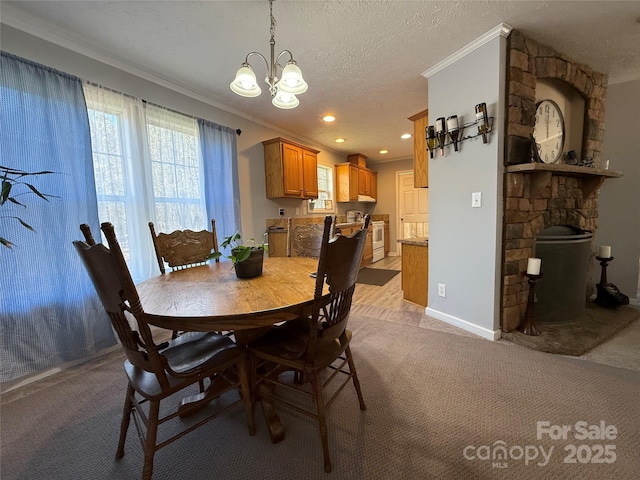 dining area with an inviting chandelier, light colored carpet, a healthy amount of sunlight, and a textured ceiling