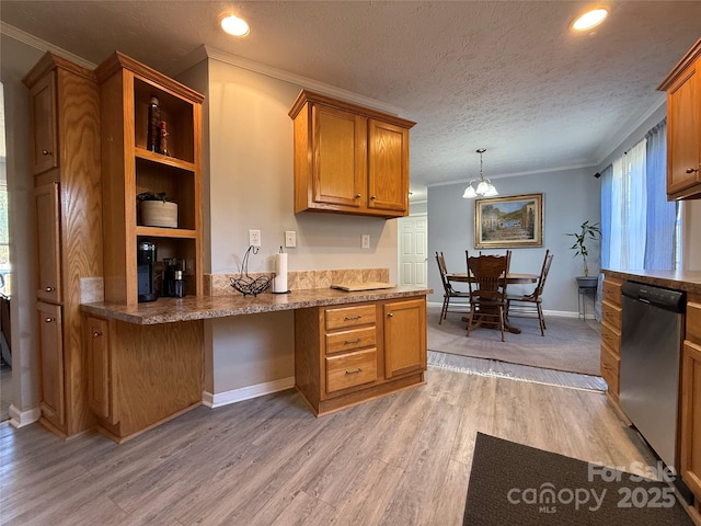 kitchen featuring built in desk, a textured ceiling, light hardwood / wood-style flooring, ornamental molding, and dishwasher