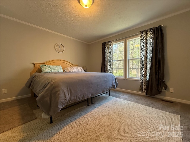 bedroom featuring ornamental molding, carpet floors, and a textured ceiling