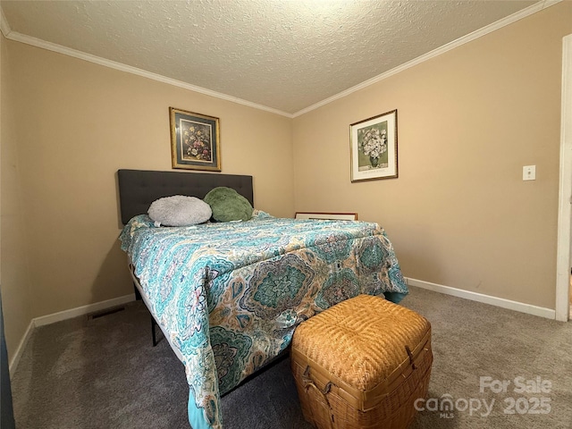 carpeted bedroom with ornamental molding and a textured ceiling