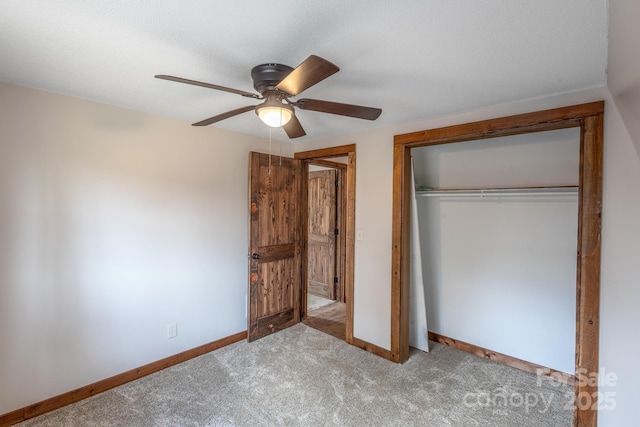 unfurnished bedroom featuring ceiling fan, light colored carpet, and a closet