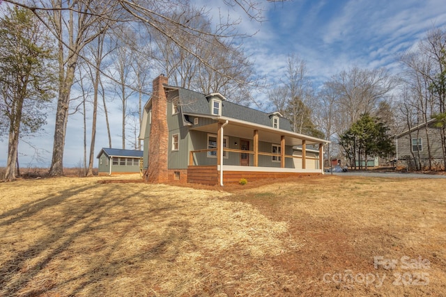 exterior space featuring a front yard and covered porch