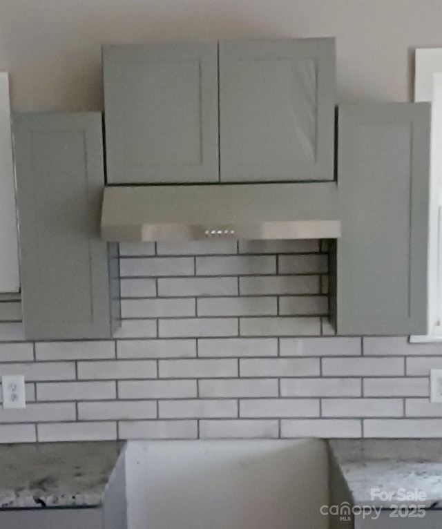 details with gray cabinets and backsplash