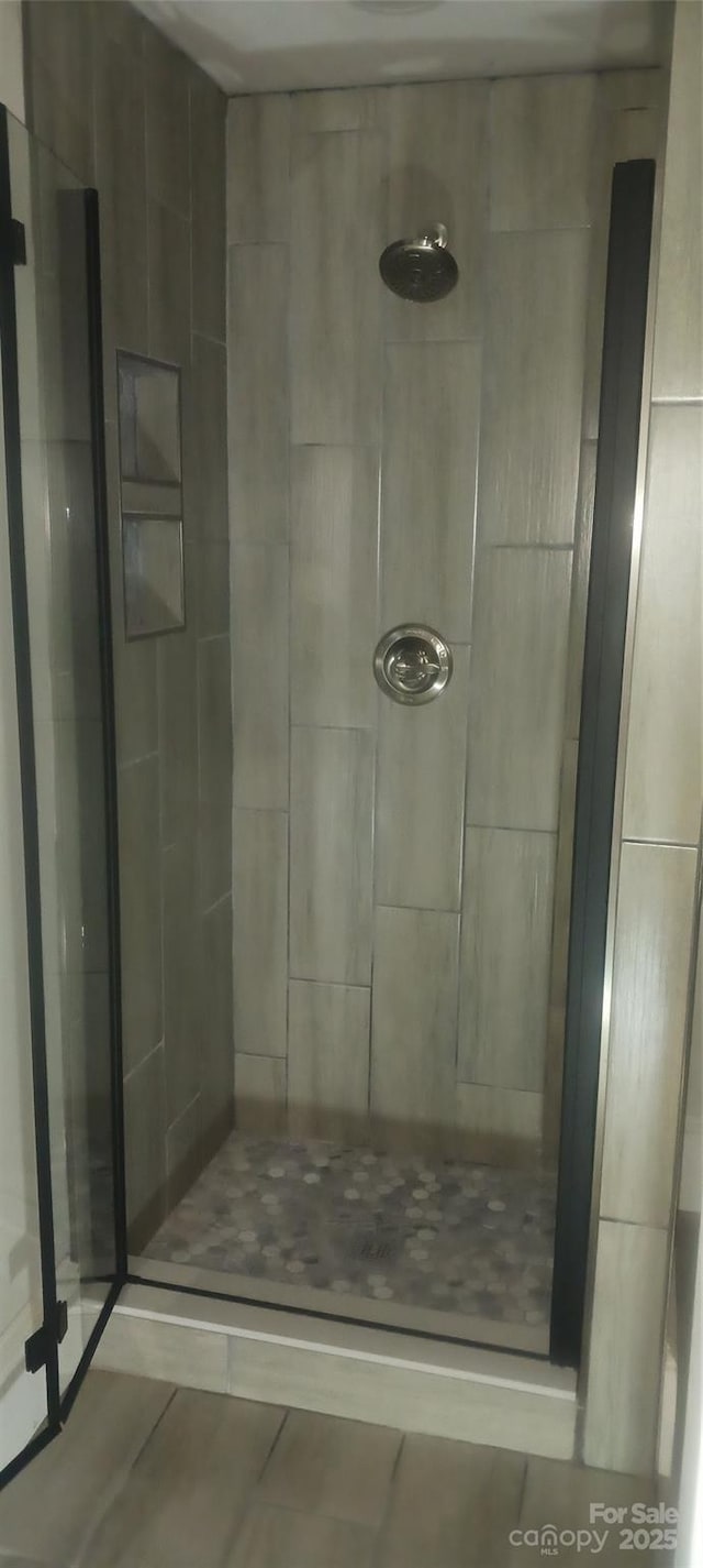 bathroom with a shower stall