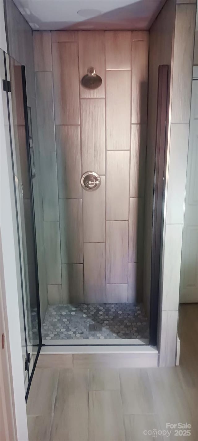 full bath with a shower stall