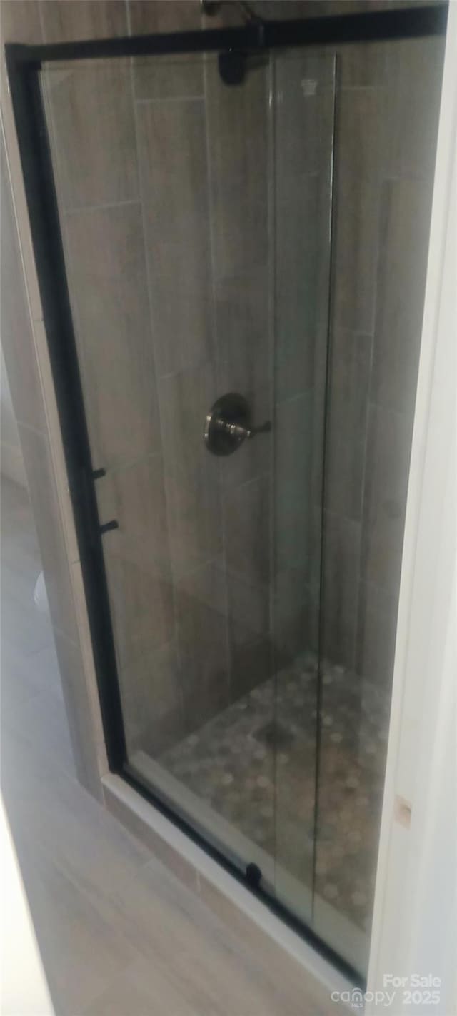 full bathroom with a shower stall