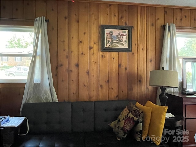 bedroom featuring wood walls