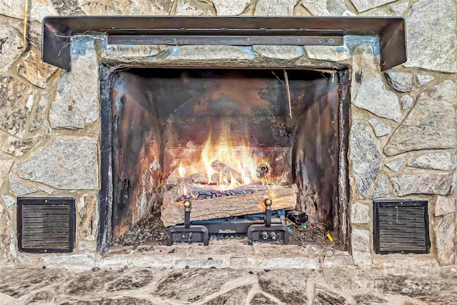 exterior details featuring a fireplace