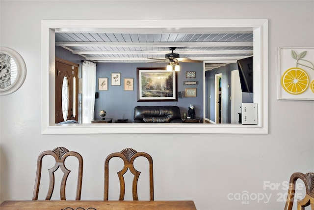 dining room with ceiling fan and beam ceiling