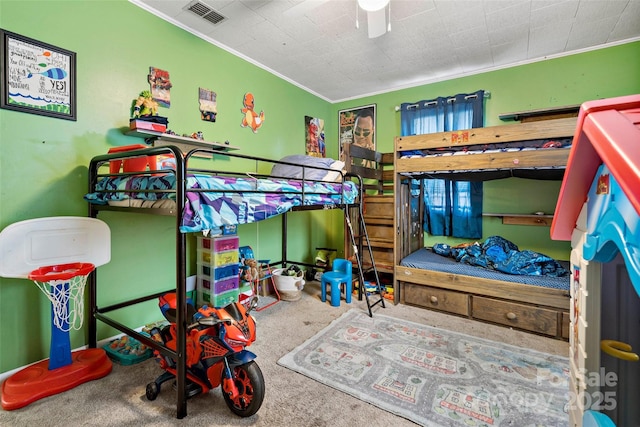 bedroom featuring crown molding and carpet