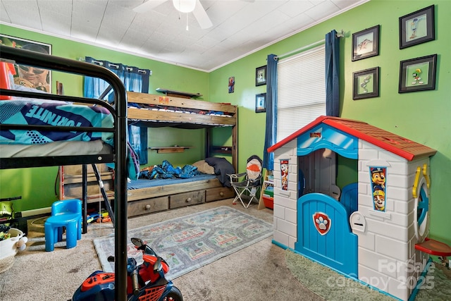 bedroom with ornamental molding and carpet