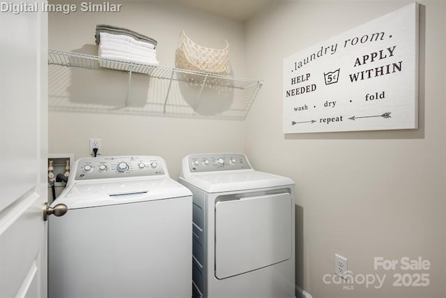 clothes washing area with washer and dryer