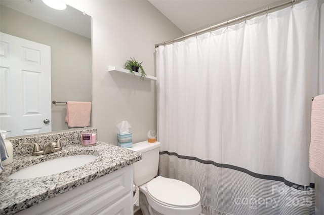 bathroom with vanity, toilet, and a shower with shower curtain