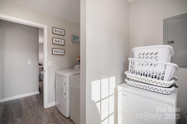 washroom with dark wood-type flooring and washer and dryer