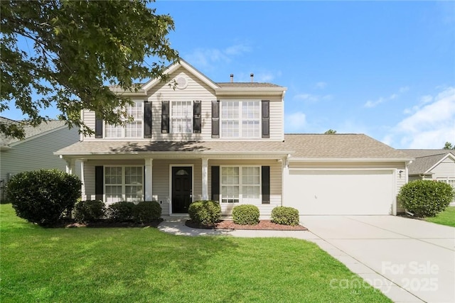 view of front of house with a garage, a porch, and a front yard