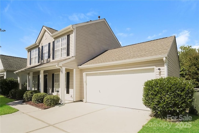 view of front of property with a garage and a porch