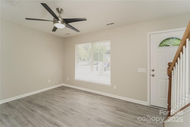 foyer entrance featuring light hardwood / wood-style flooring and ceiling fan