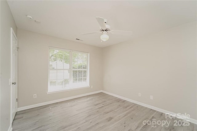 unfurnished room featuring ceiling fan and light hardwood / wood-style flooring