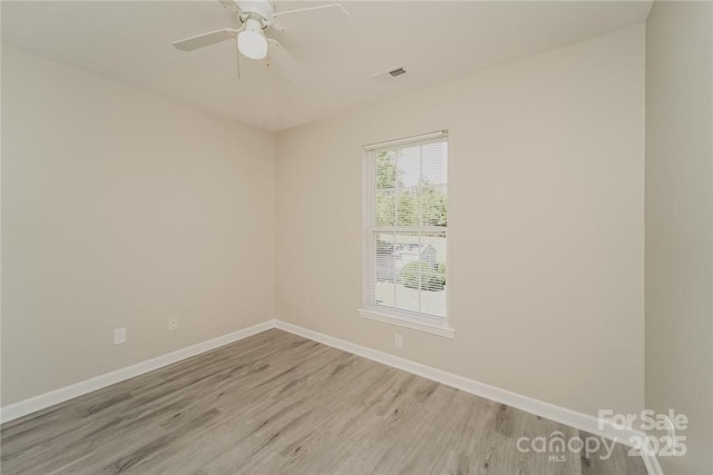 spare room with ceiling fan and light hardwood / wood-style floors