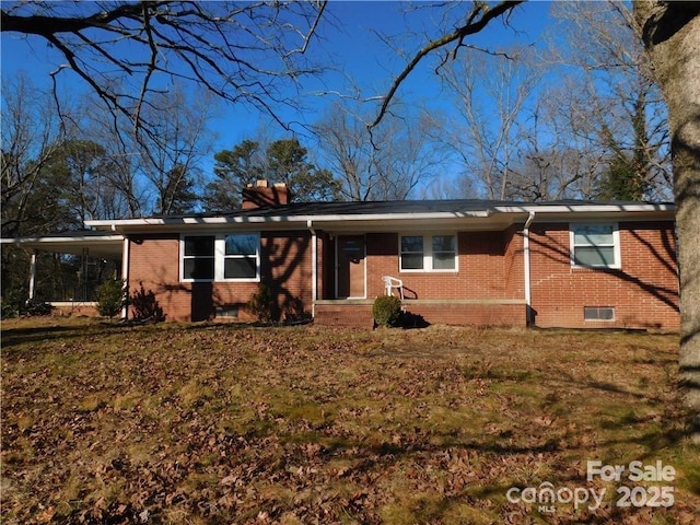 ranch-style home with a carport