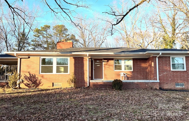 ranch-style home with a carport