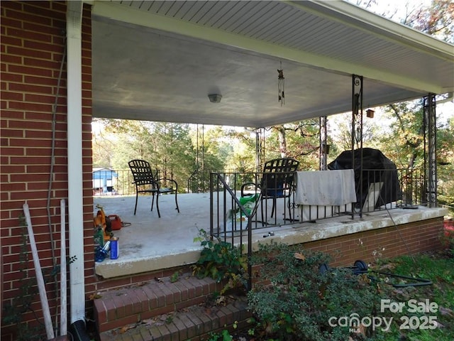 wooden terrace with area for grilling