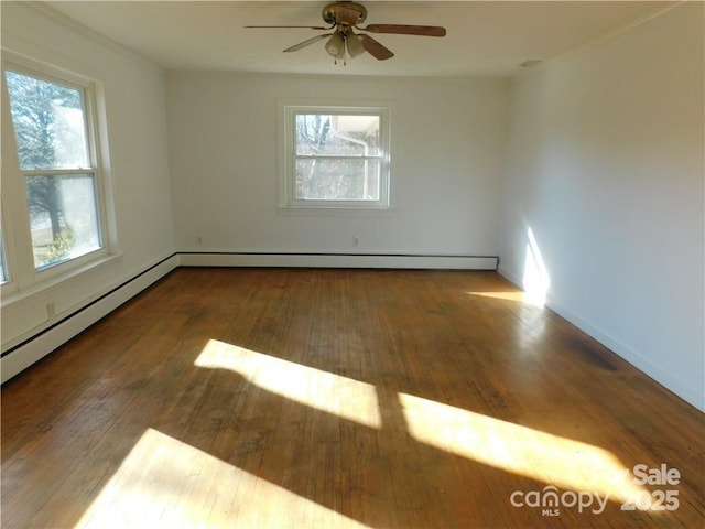 spare room featuring hardwood / wood-style floors and a wealth of natural light