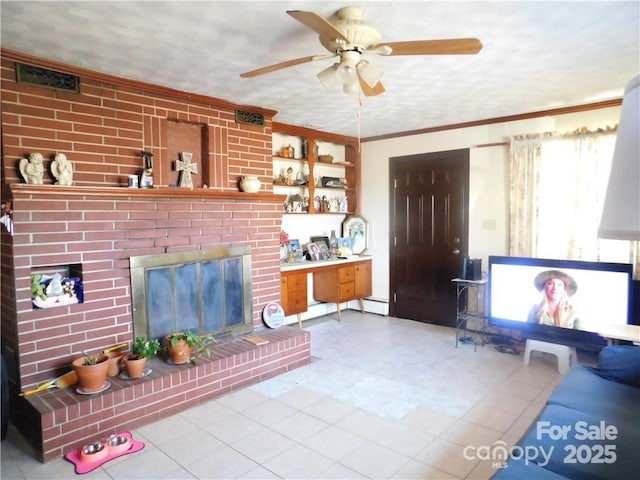 living room with crown molding, a baseboard radiator, ceiling fan, and a brick fireplace