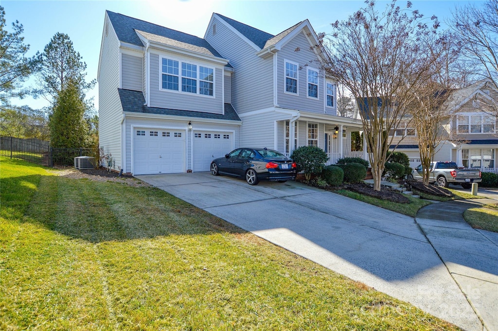 view of front of house featuring a porch, a garage, a front lawn, and central air condition unit