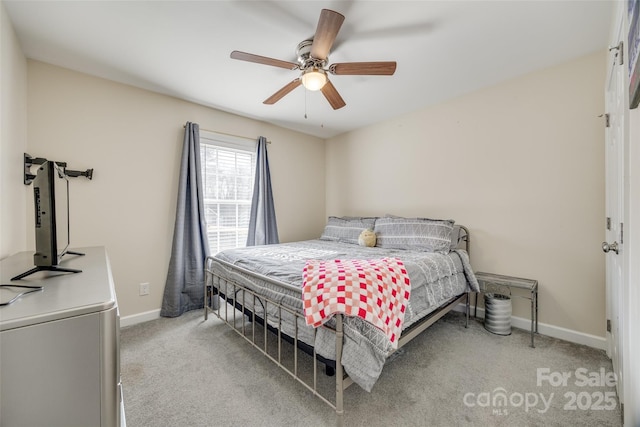 bedroom featuring light colored carpet and ceiling fan