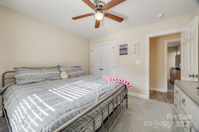 carpeted bedroom with a closet and ceiling fan