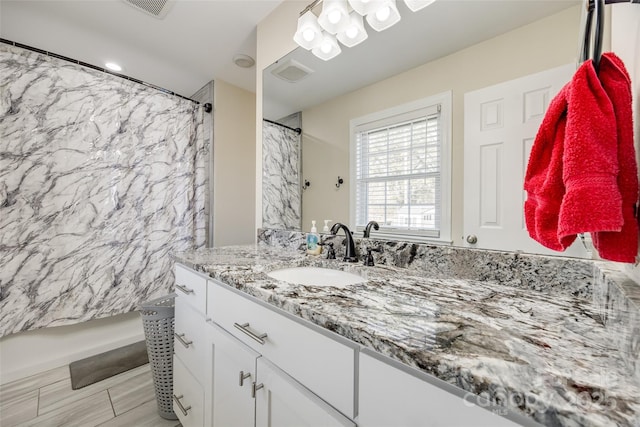 bathroom featuring vanity and shower / tub combo