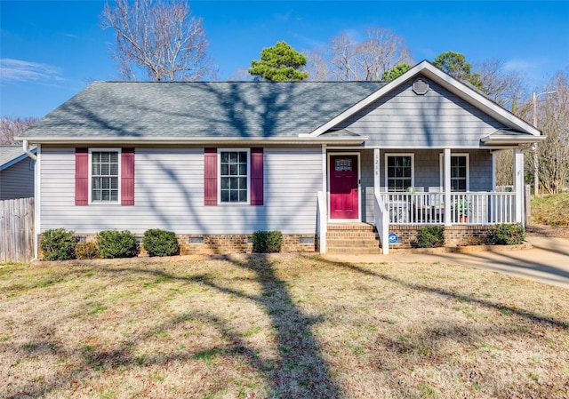 ranch-style house with a front yard and covered porch