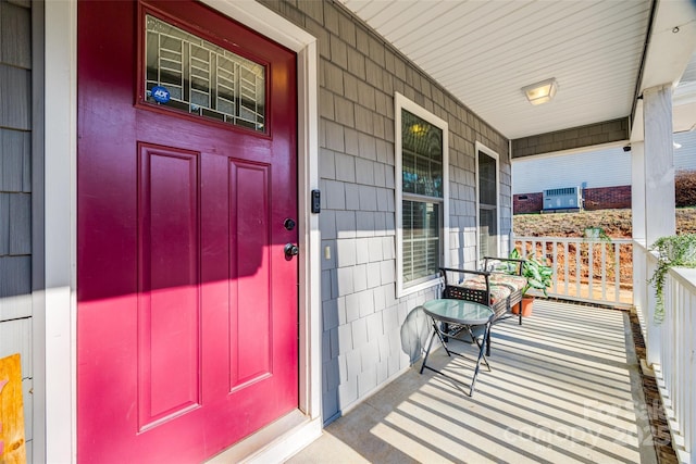 doorway to property with a porch