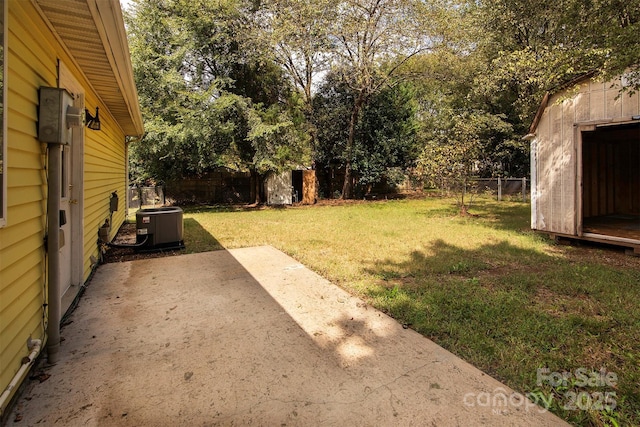 view of yard with cooling unit and a patio area