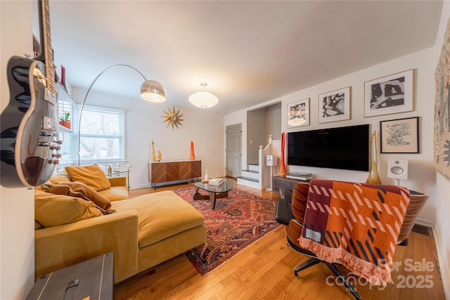 living room with hardwood / wood-style flooring