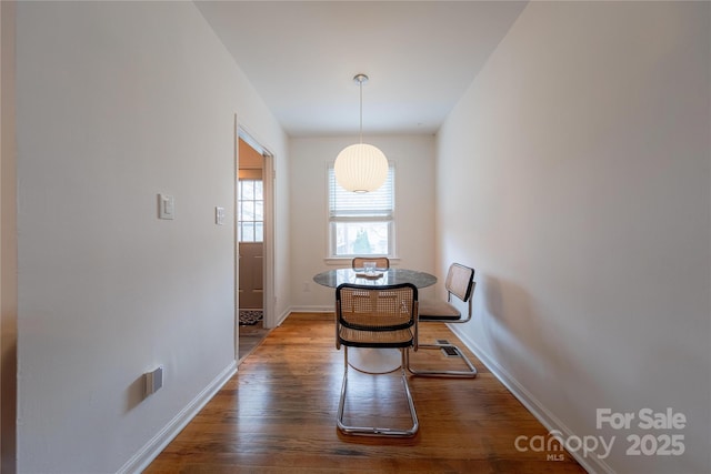 unfurnished dining area featuring dark hardwood / wood-style flooring