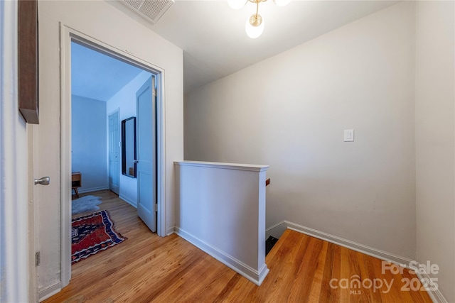 hall with light hardwood / wood-style flooring