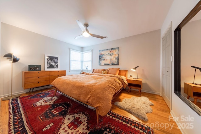 bedroom featuring ceiling fan and light wood-type flooring