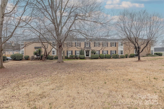 colonial house with a front lawn