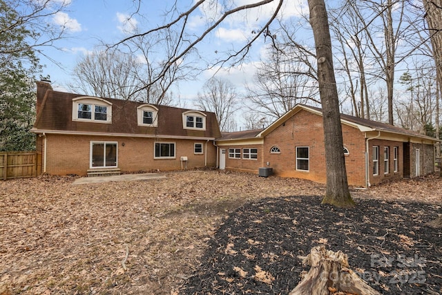 back of property with a patio