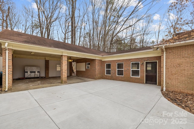 view of side of property with a carport