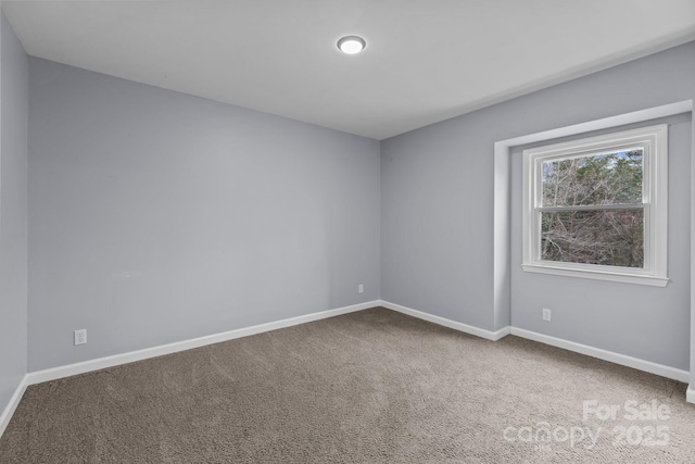 empty room with carpet flooring