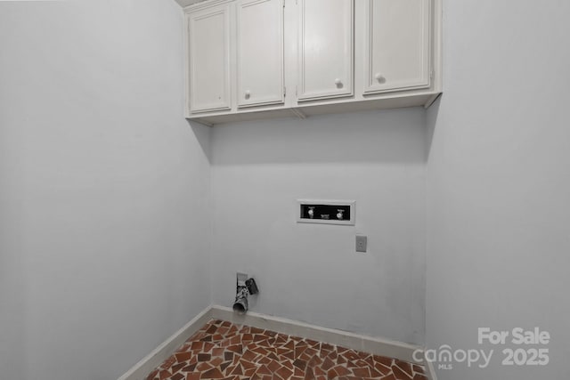 clothes washing area featuring cabinets and washer hookup