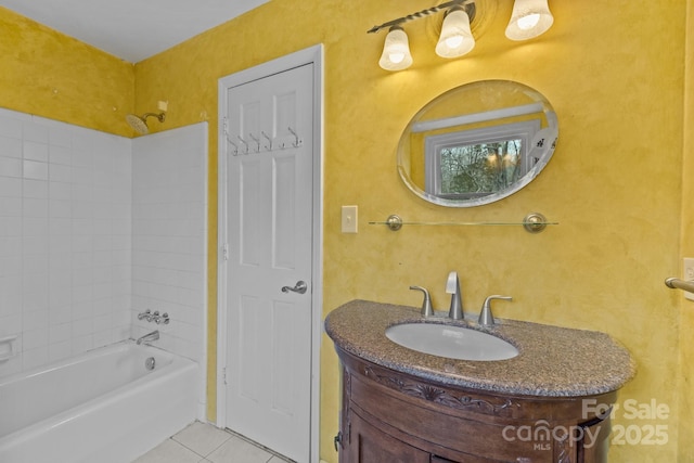 bathroom featuring vanity, tub / shower combination, and tile patterned floors