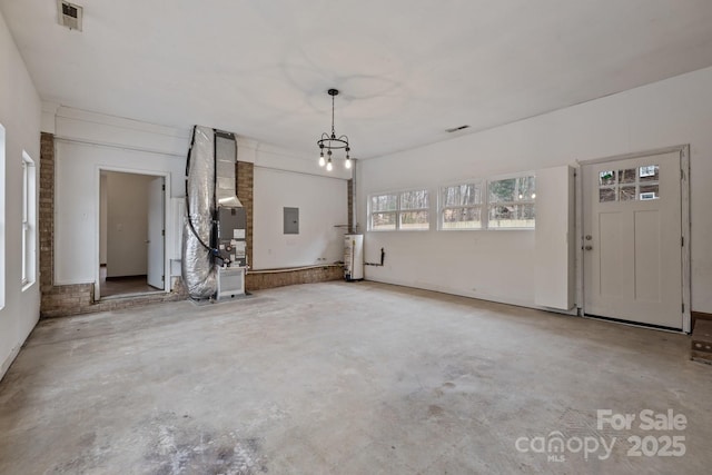 interior space featuring heating unit, electric panel, and water heater