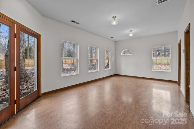 unfurnished room featuring wood-type flooring