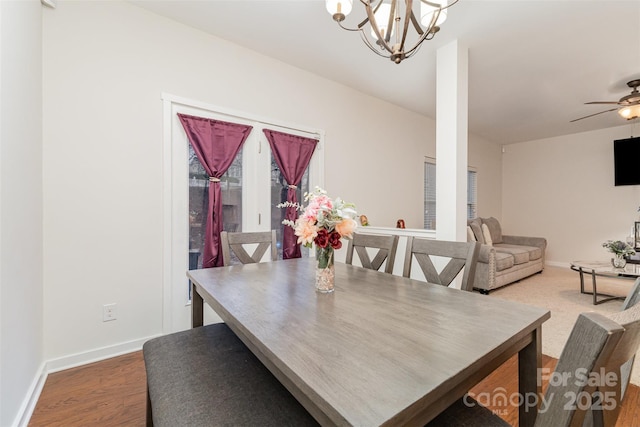 dining area with an inviting chandelier and hardwood / wood-style floors